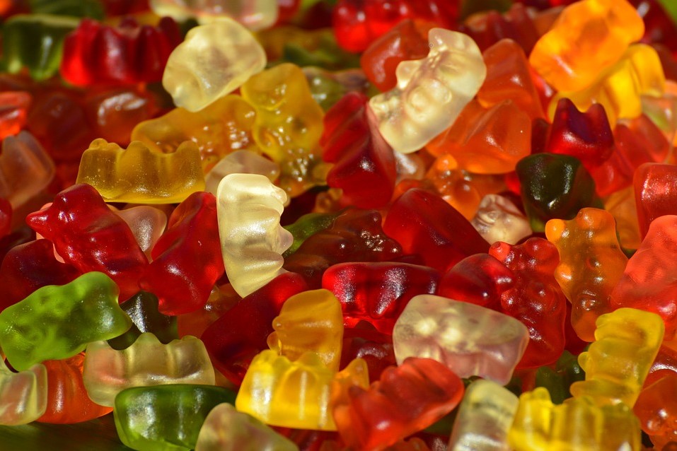 A pile of colorful gummy bears, ready for bottling